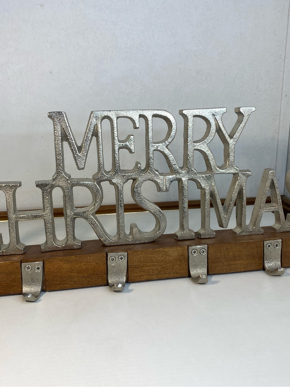 Merry Christmas stocking holder with a wooden stand